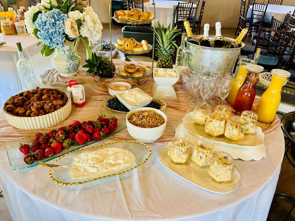 Wider shot of the food display with mimosas and champagne