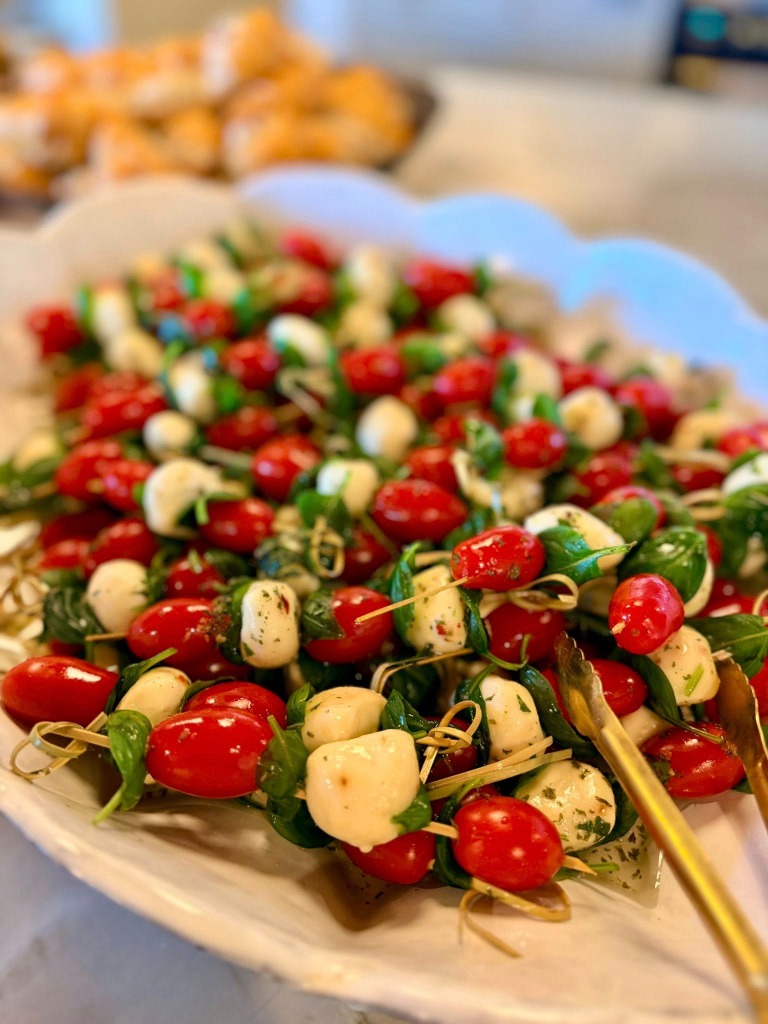 Caprese salad skewers with cherry tomatoes, mozzarella, and basil